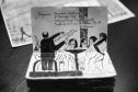 Fã da Orquestra Sinfônica do Paraná e de Beatles, artista ilustra concertos há uma década